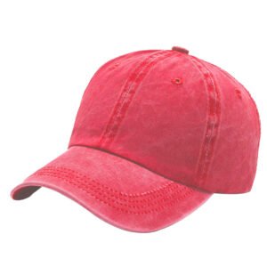 Vivid red faded washed cotton baseball cap, soft unstructured crown, air ventilation holes adjustable buckle strap studio shot