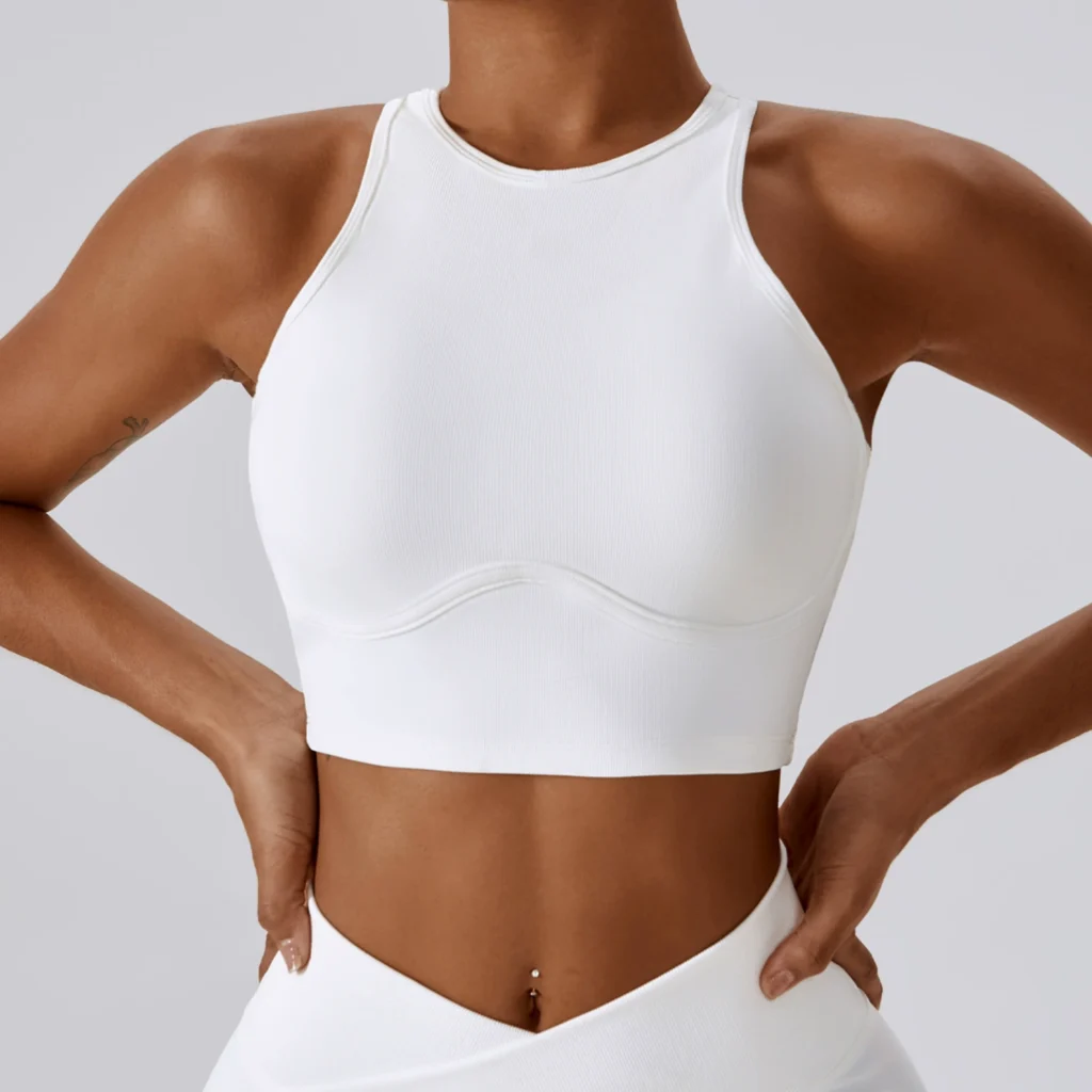 Women white ribbed sports yoga bra, high halter neck, curved under bust seam, removable padding, front studio model shot