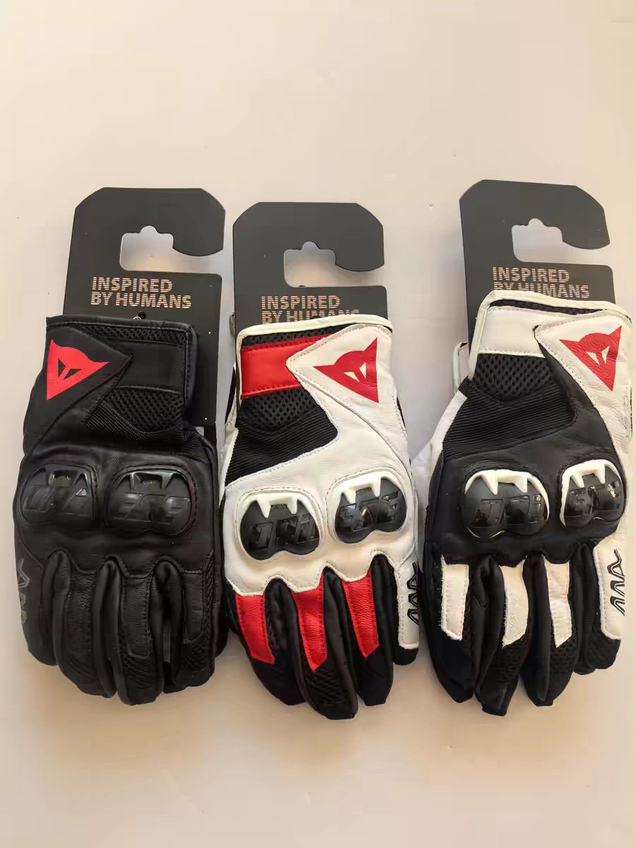Black, white, and red universal riding gloves photographed in real life
