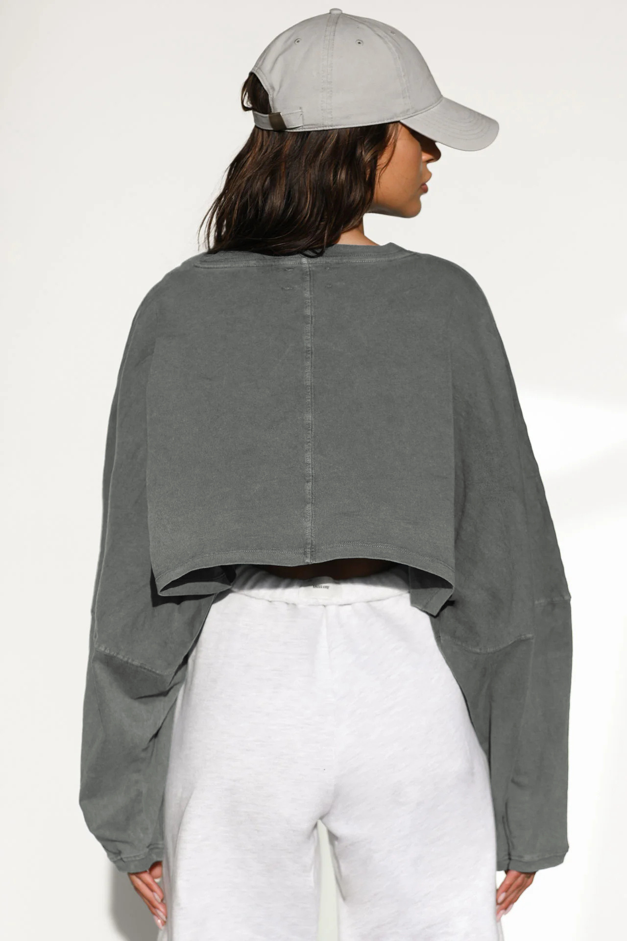 Washed Gray Cropped Sweatshirt - Back View Back view of women's oversized cropped long sleeve sweatshirt in washed gray, showing back seam detail and relaxed fit, vintage pigment dyed loungewear top