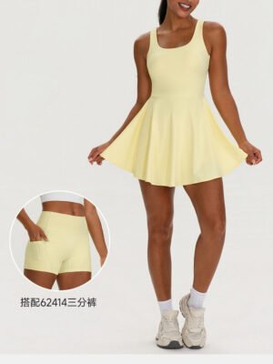 Yellow two-piece tennis skirt set full look with sneakers