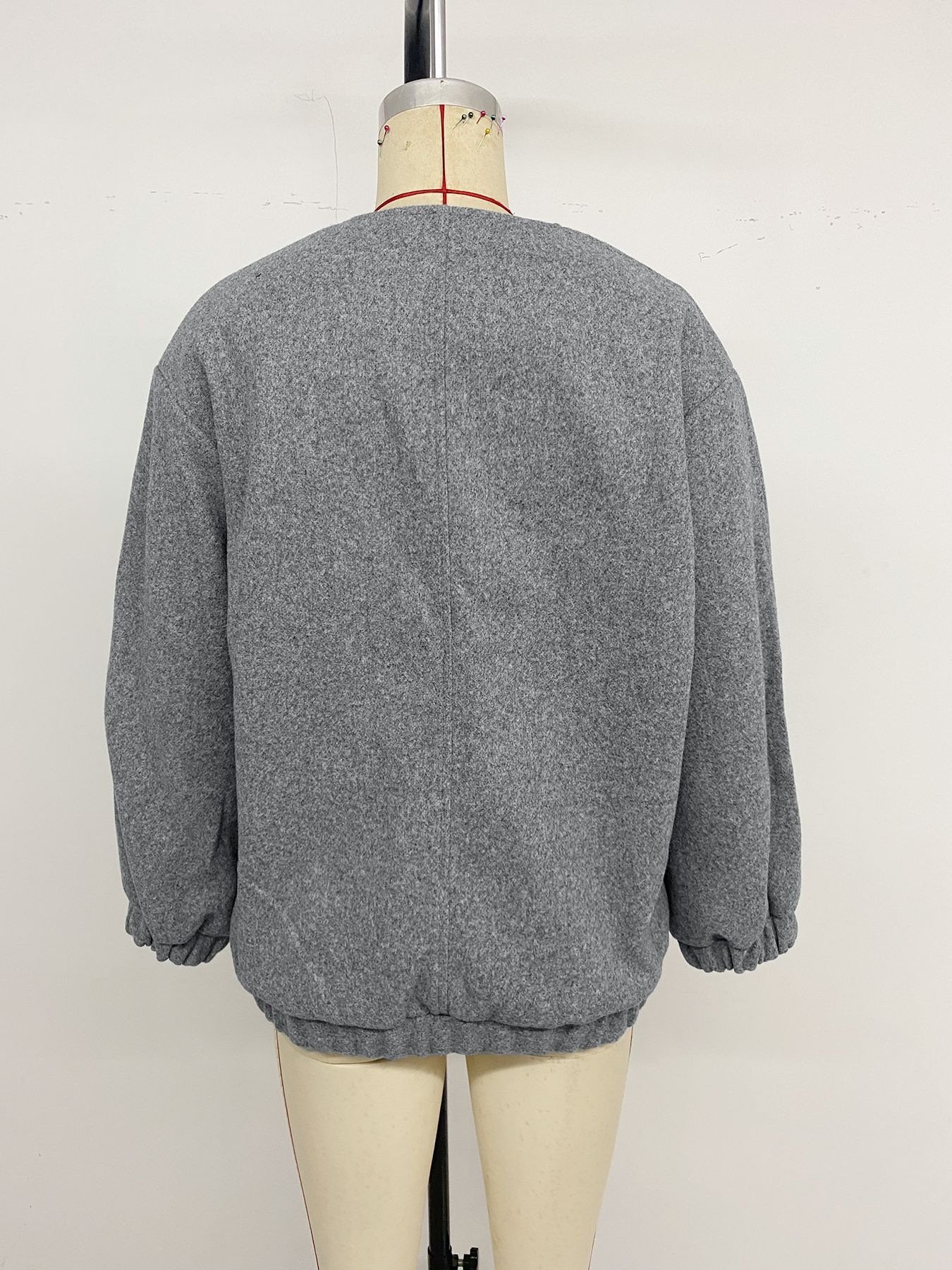 Grey casual woolen jacket back view vertical seam rib hem design